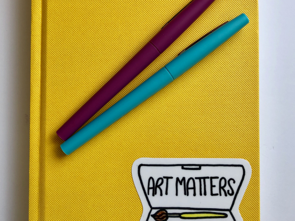Art Matters vinyl sticker on journal